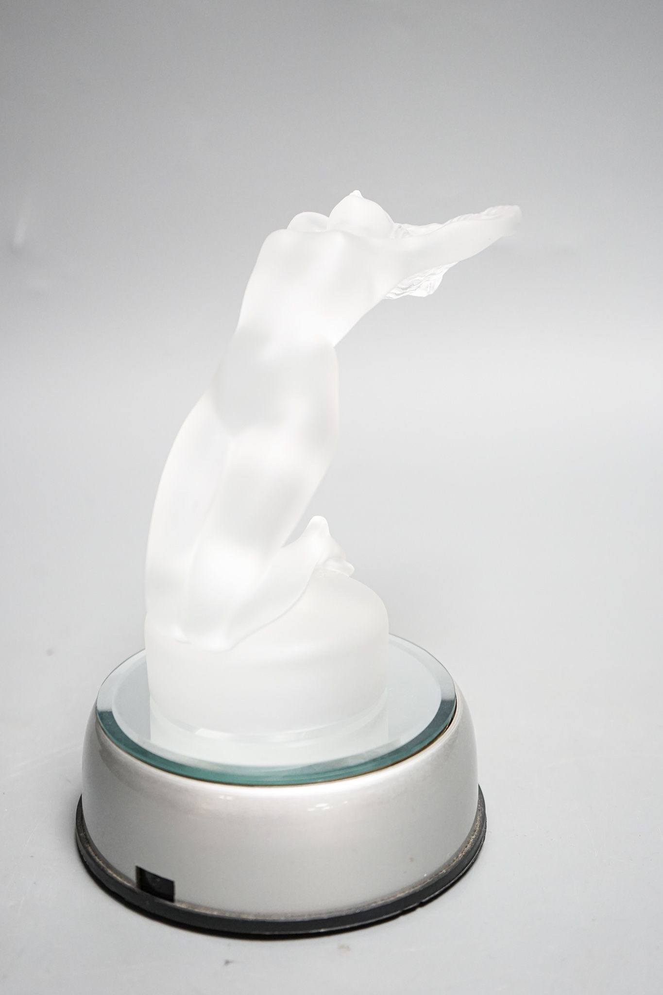 A post war Lalique Chrysis clear frosted glass paperweight or car mascot, with light up base. 13cm excl base